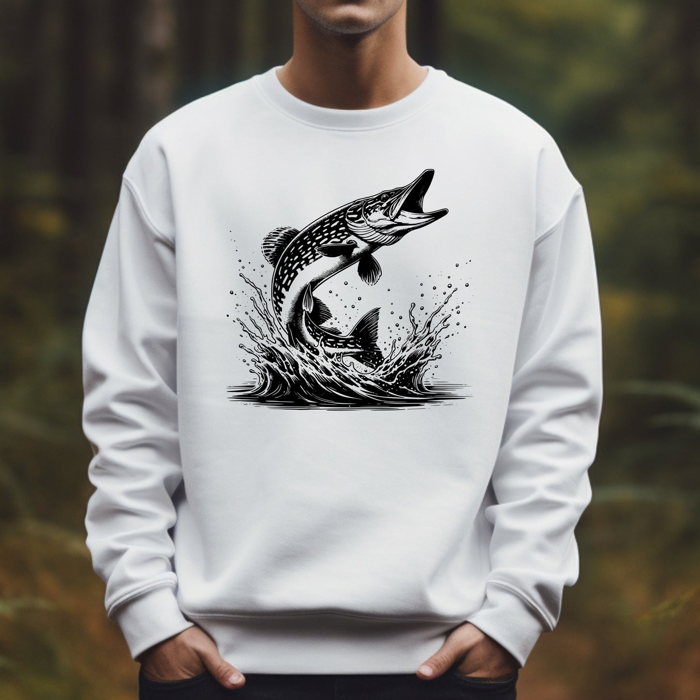 White sweatshirt with a black pike fish graphic worn by a man against a blurred natural background