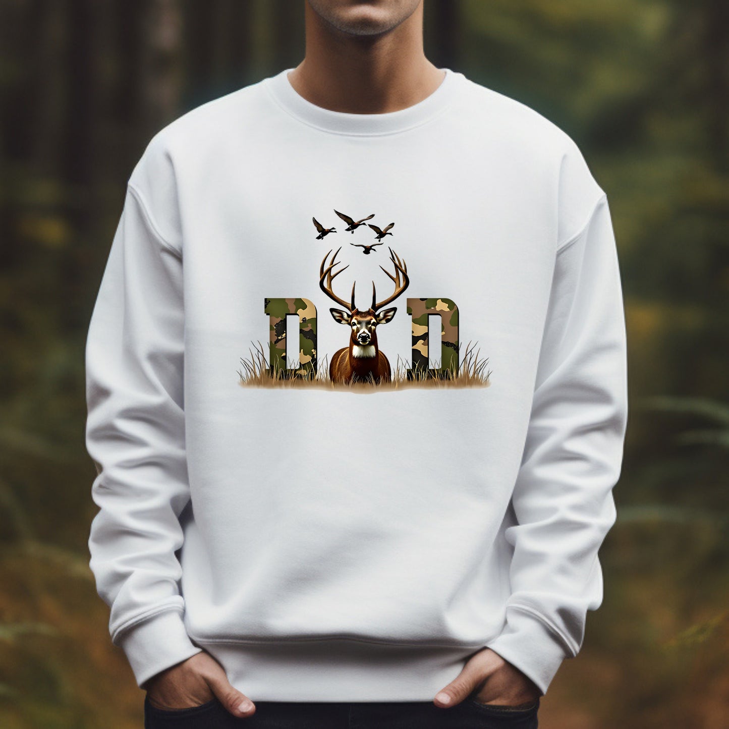 White sweatshirt with a deer and 'Dad' design against a blurred natural background
