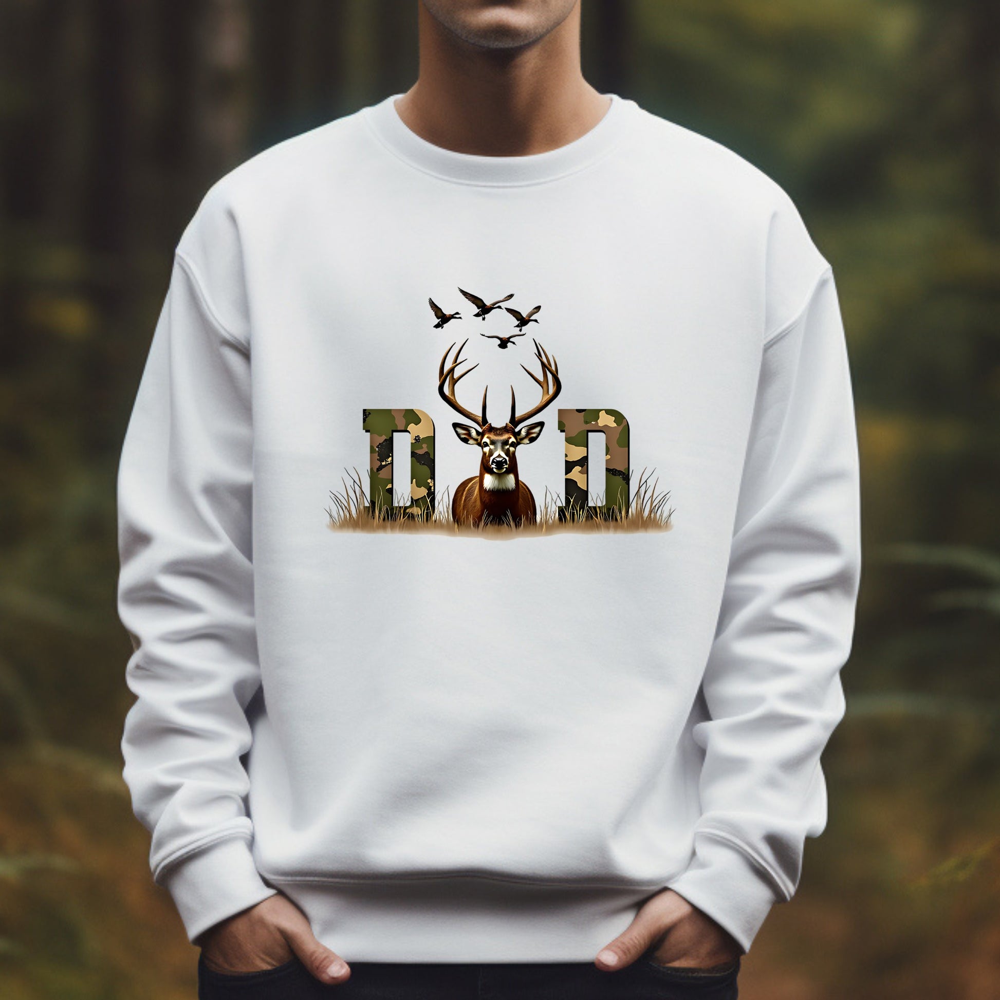 White sweatshirt with a deer and 'Dad' design against a blurred natural background