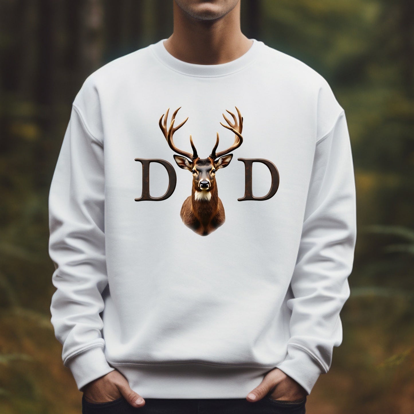 White sweatshirt with a deer design and 'DD' letters against a blurred forest background