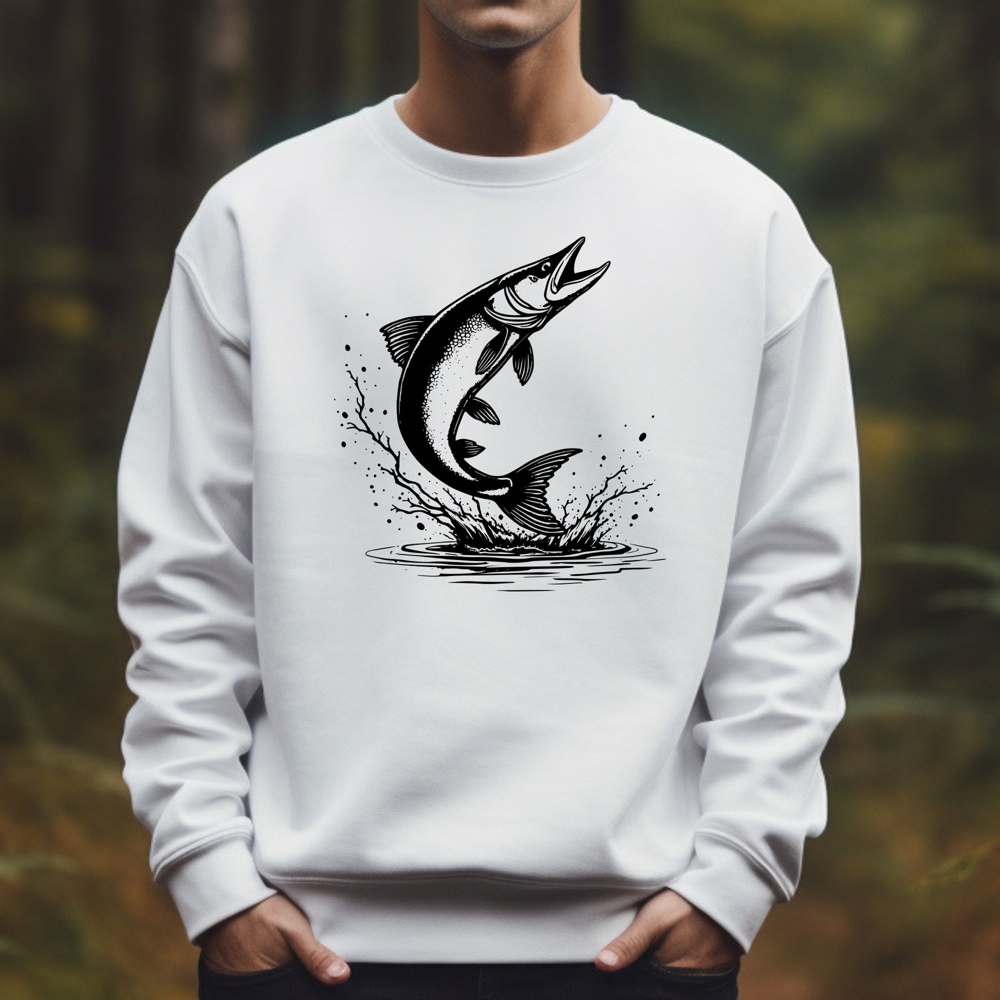 White sweatshirt with a black muskie silhouette fish graphic worn by a man against a blurred natural background