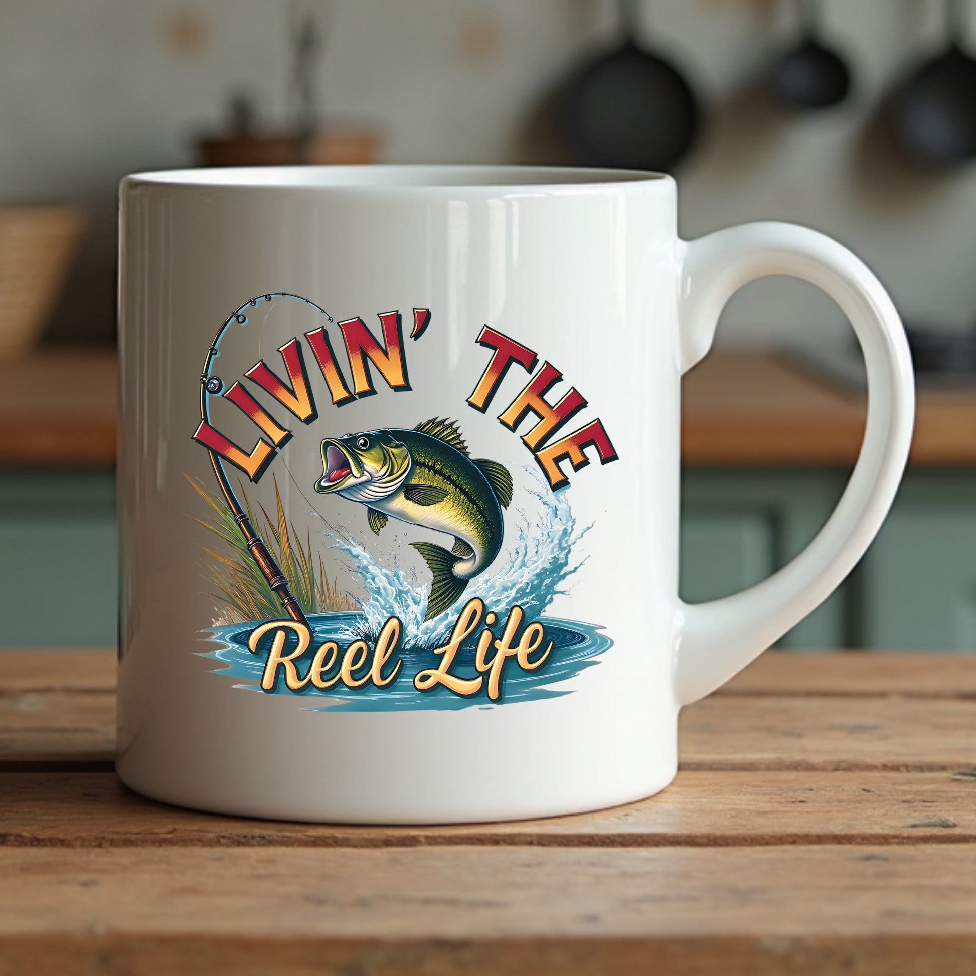 White mug with 'Livin' the Reel Life' fishing design on a wooden surface.