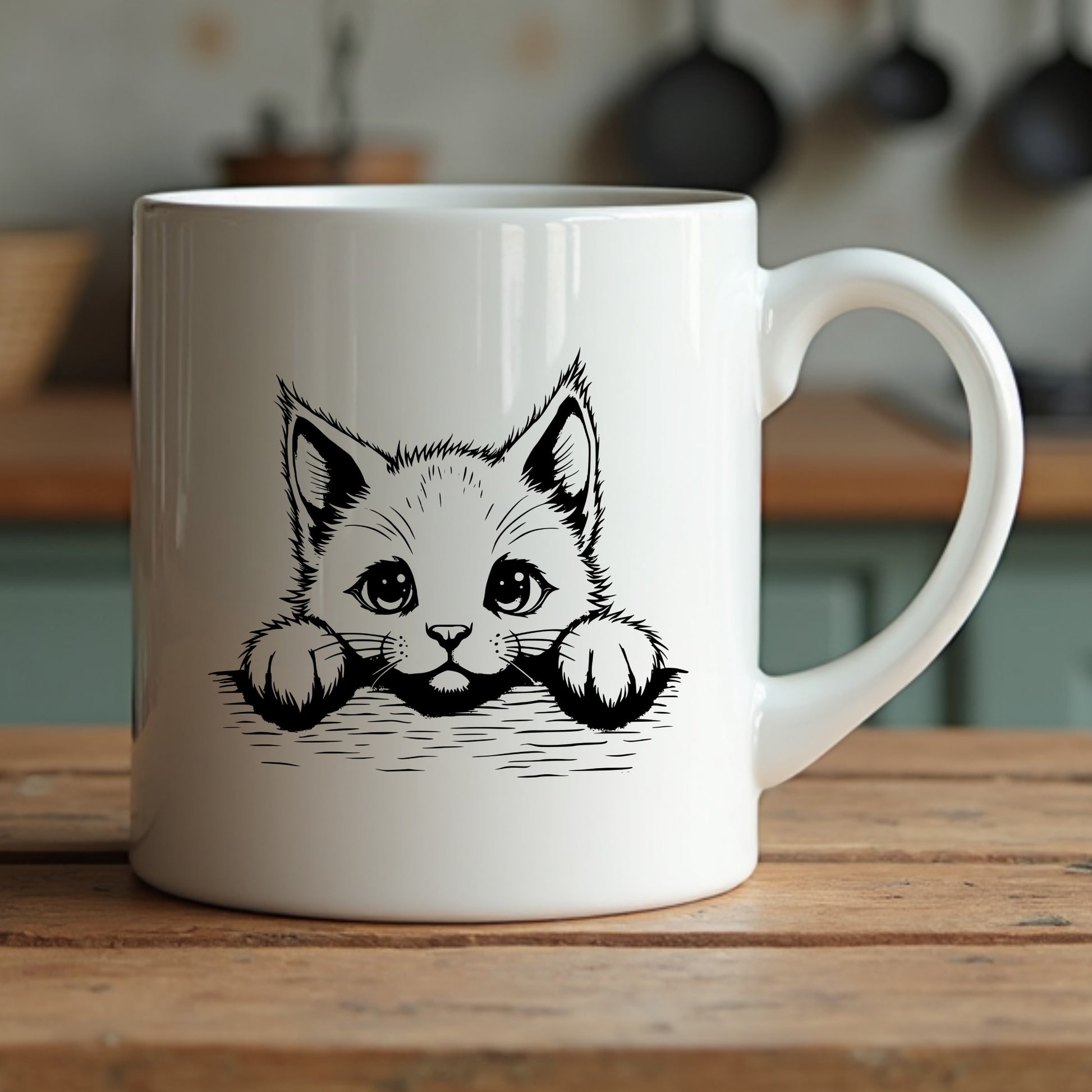White mug with a black kitten illustration on a wooden surface
