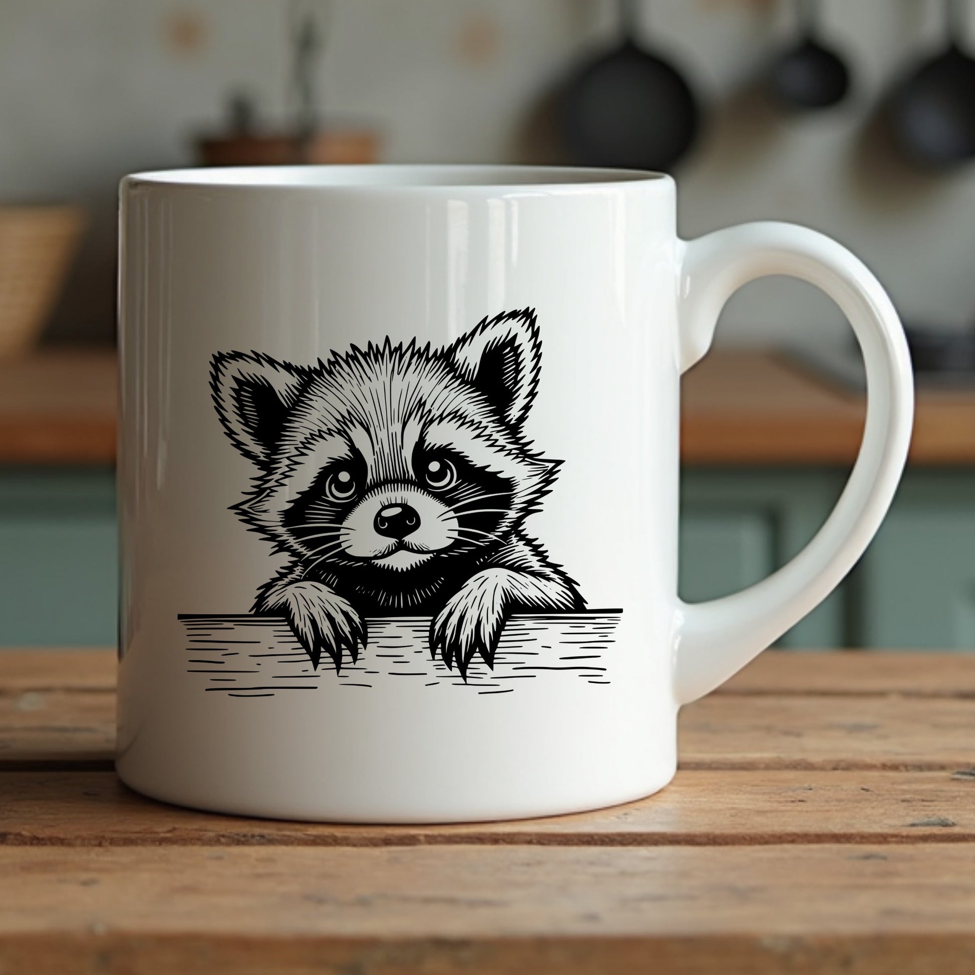 White mug with a raccoon illustration sitting on a wooden surface