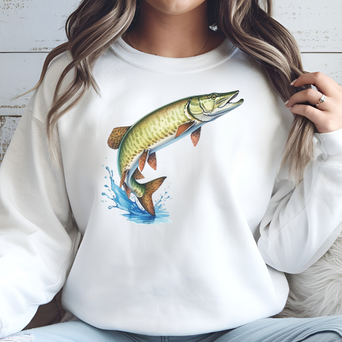 Muskie Fish PNG digital design on a woman's white sweatshirt