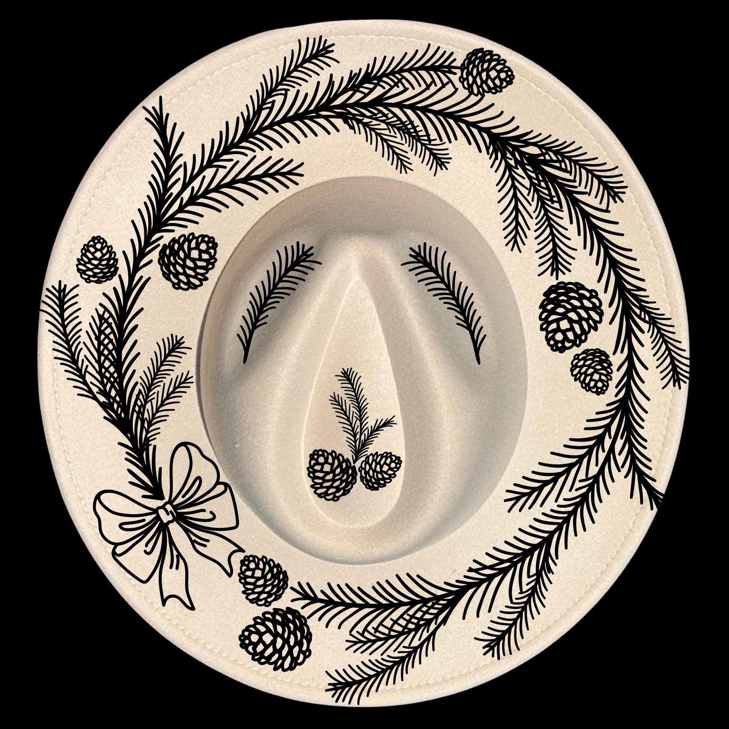 Decorative pine wreath design of branches, bow, and pinecones on a wide brim hat