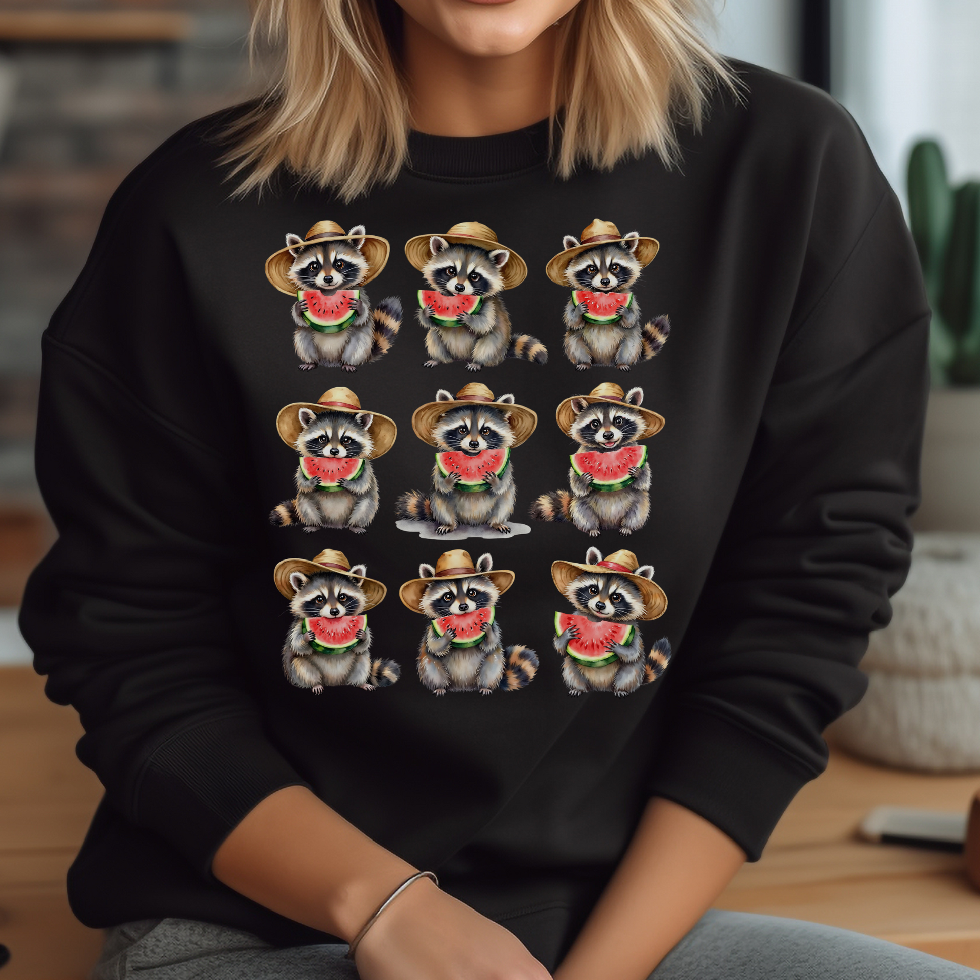 Raccoons Eating Watermelon PNG digital design on a woman's black sweatshirt