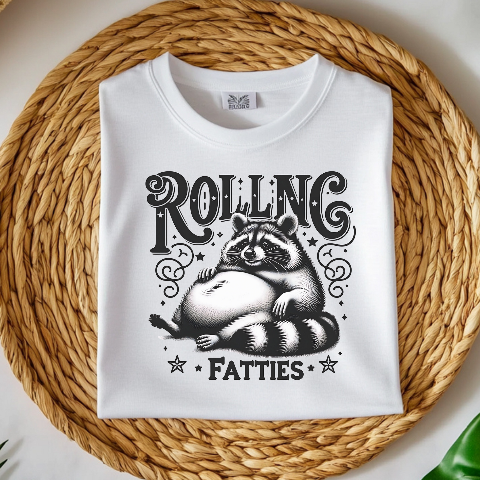 Rolling Fatties Raccoon PNG digital design on a folded t-shirt