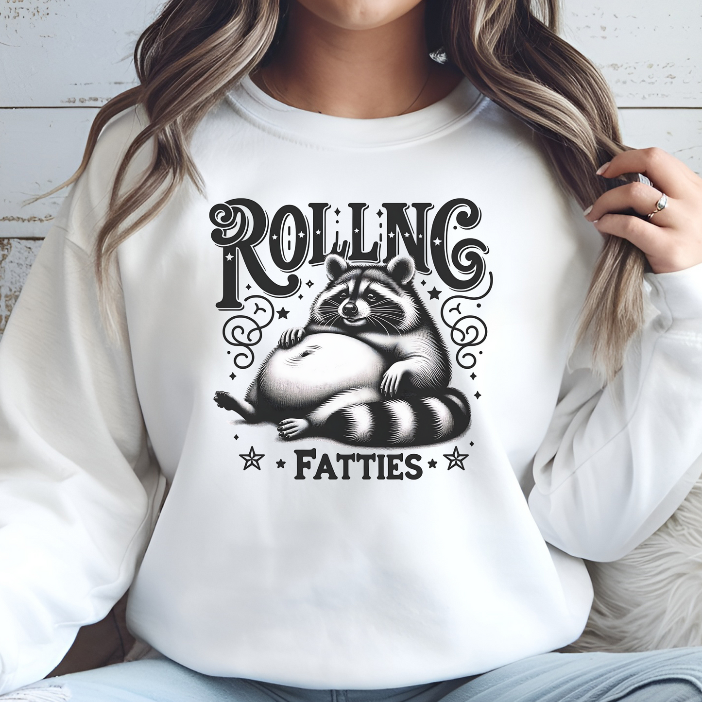 Rolling Fatties Raccoon PNG digital design on a woman's white sweatshirt