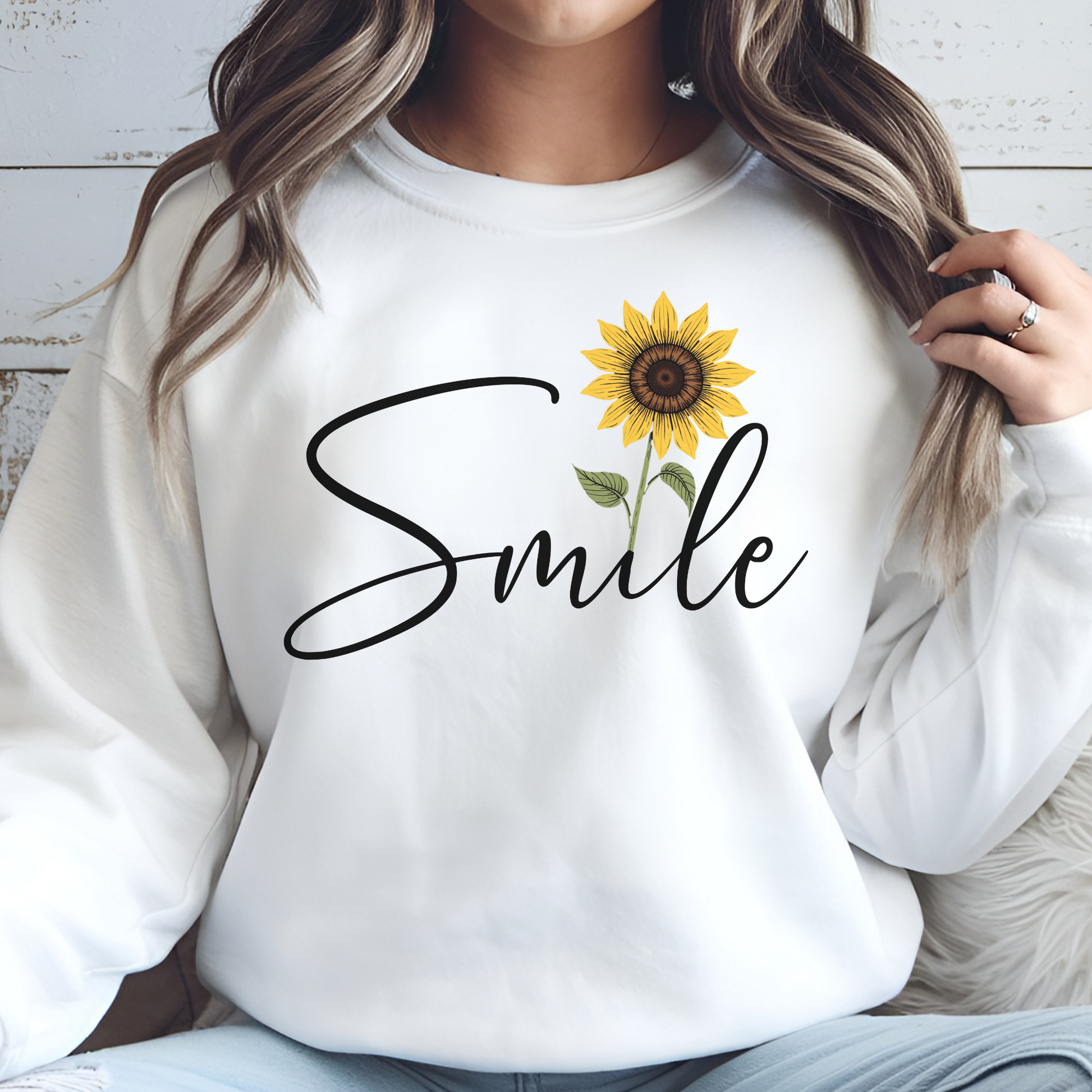 Sunflower Smile PNG digital design on a woman's white sweatshirt
