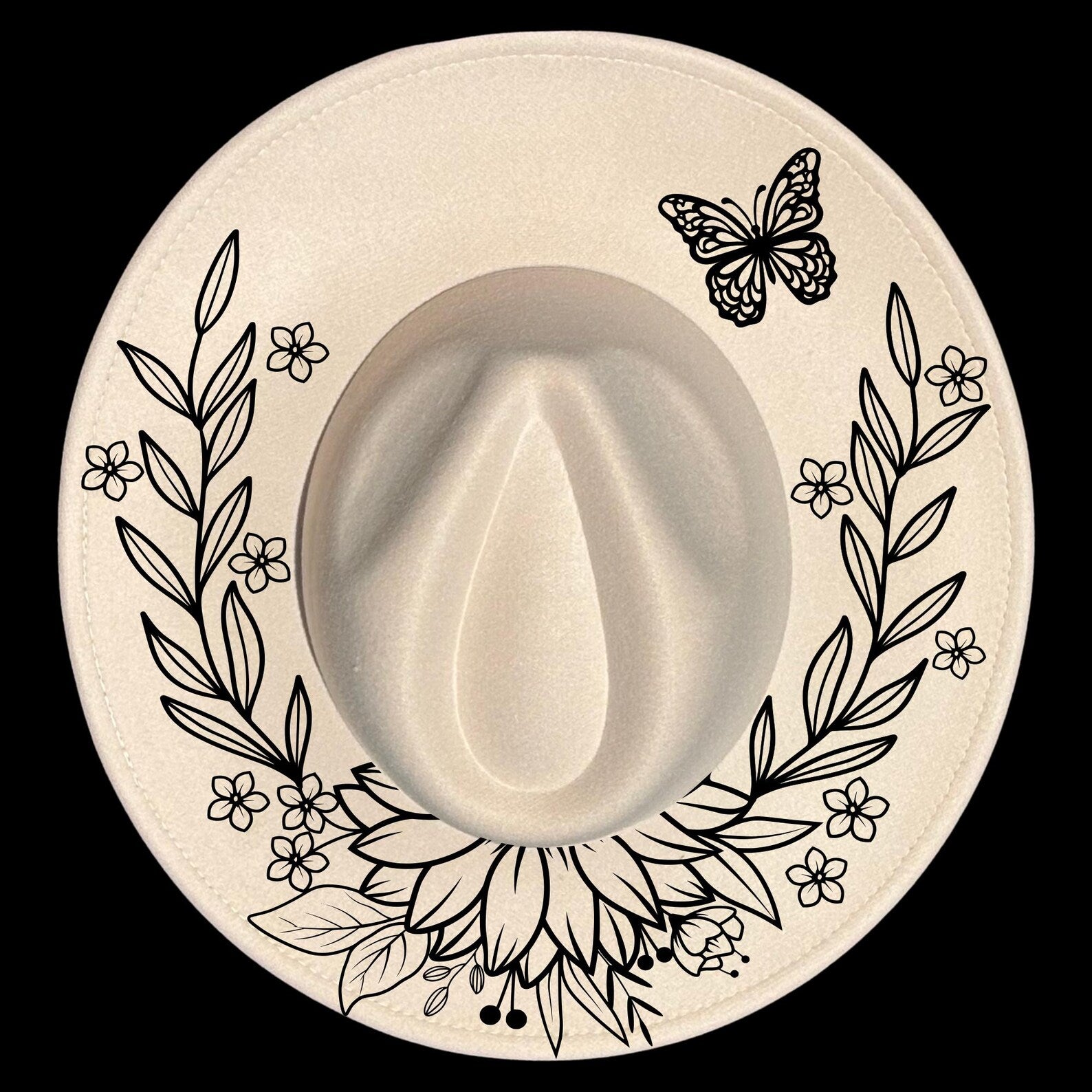 Wide brim hat with floral and butterfly design on a black background