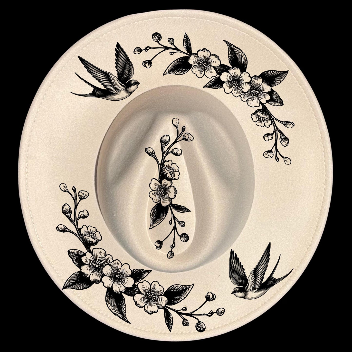 Hat burning design with black floral and swallows designs on a wide brim hat