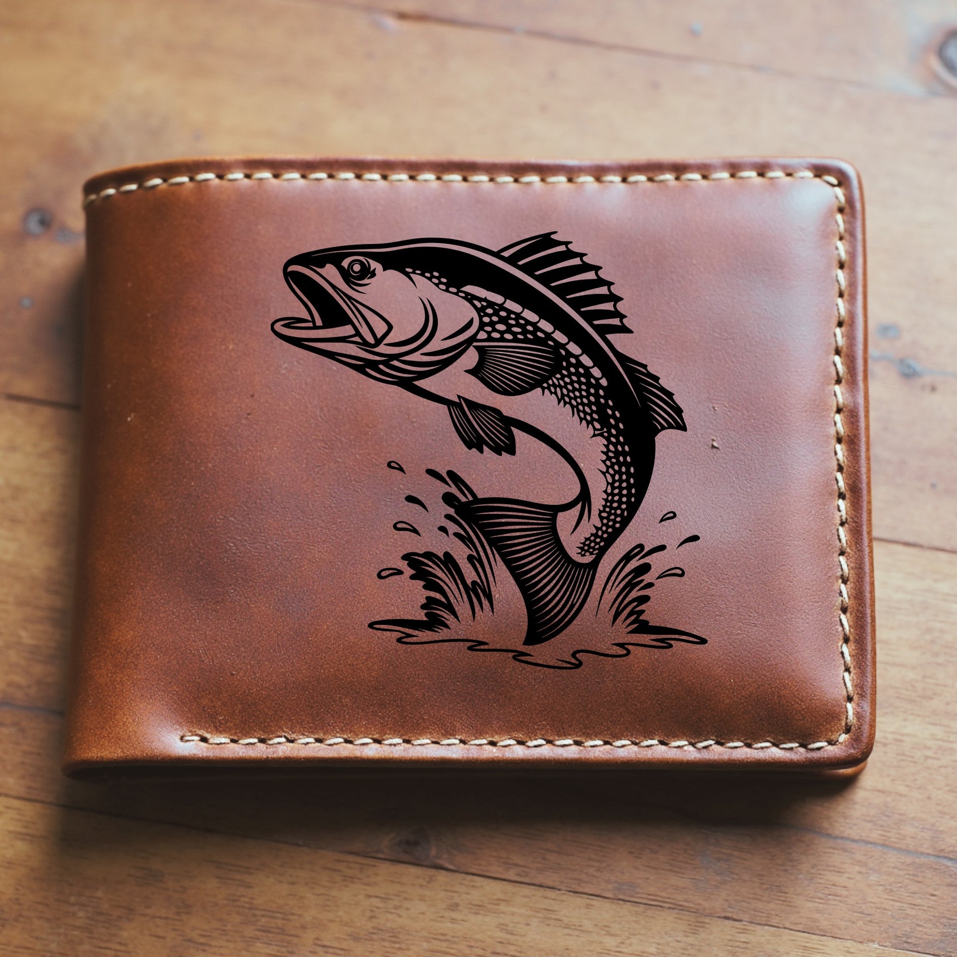 Brown leather wallet with a walleye fish engraving