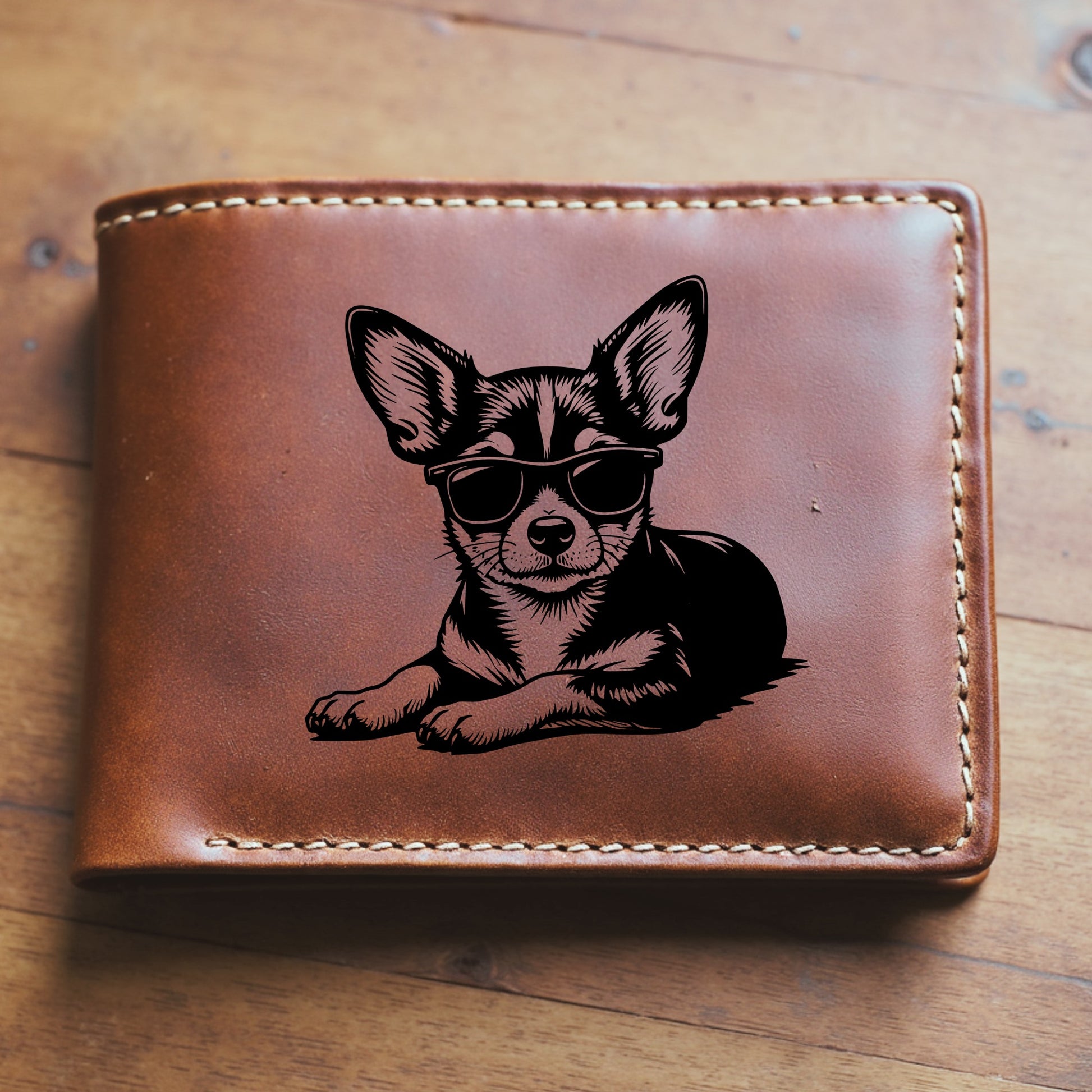 Brown leather wallet with a engraved dog wearing sunglasses on a wooden surface