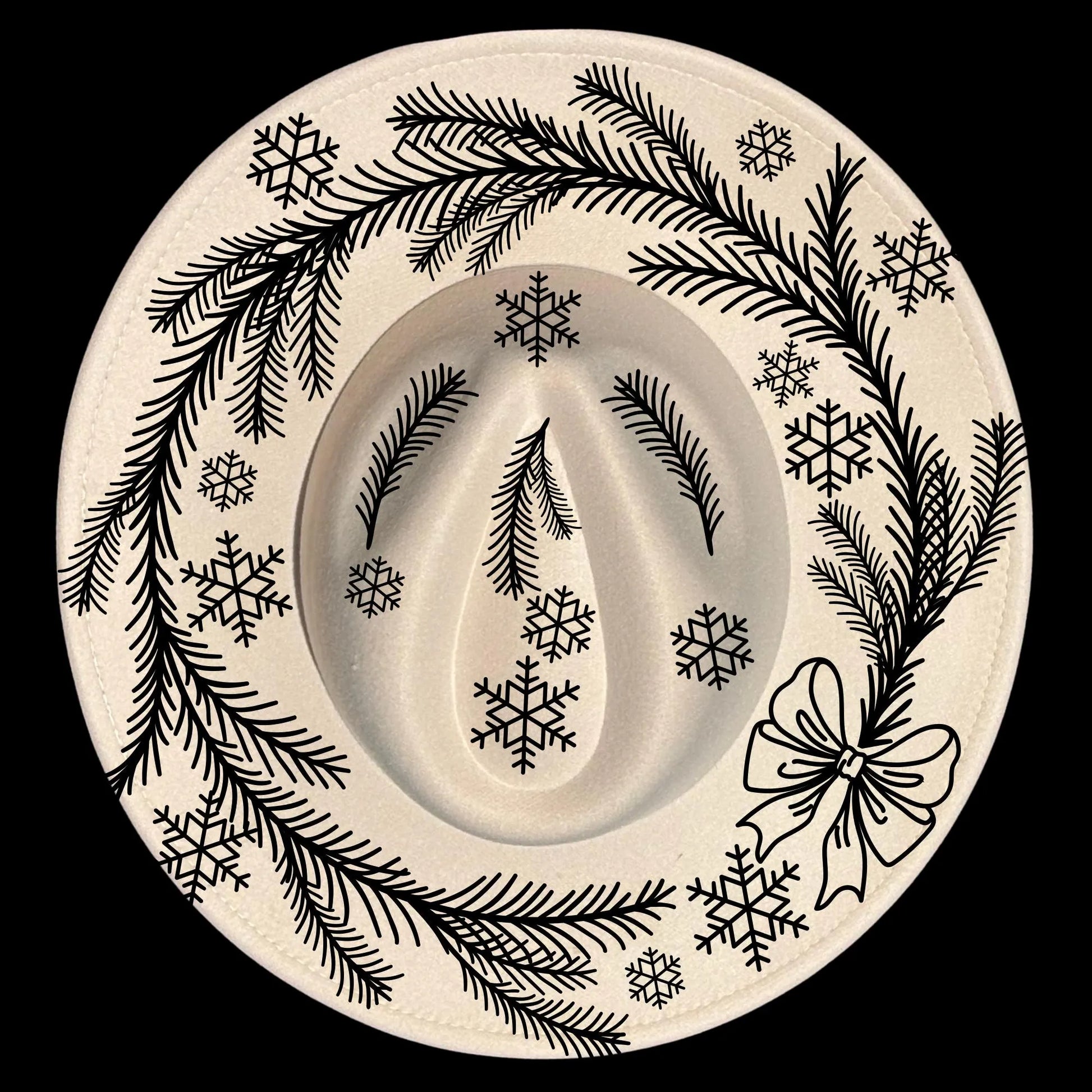 Decorative hat burning design with black winter-themed design on a wide brim hat