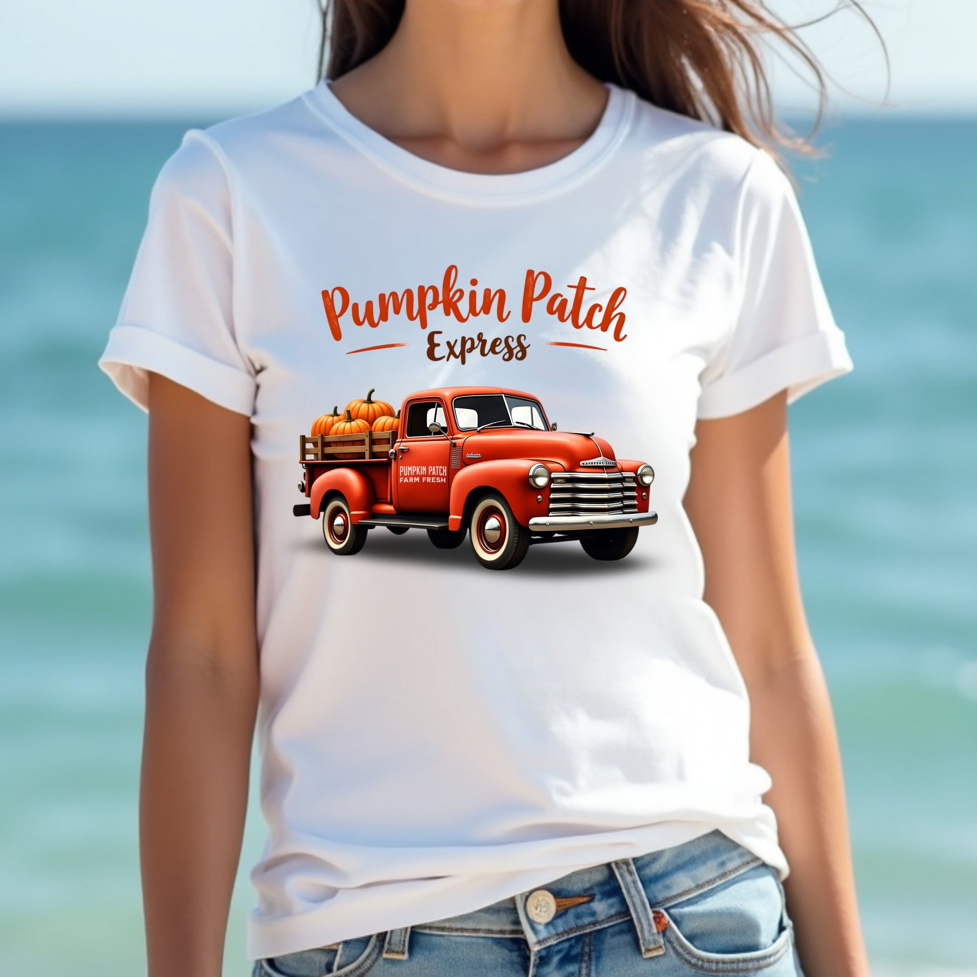 A woman wearing a pumpkin patch express t-shirt at the beach