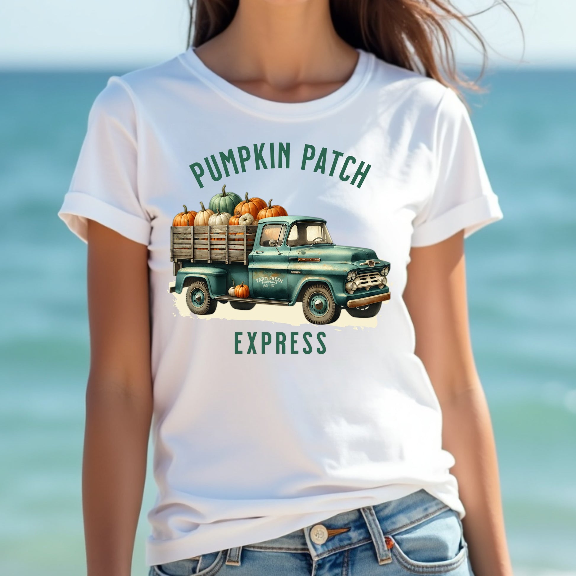 A woman wearing a pumpkin patch express t-shirt at the beach