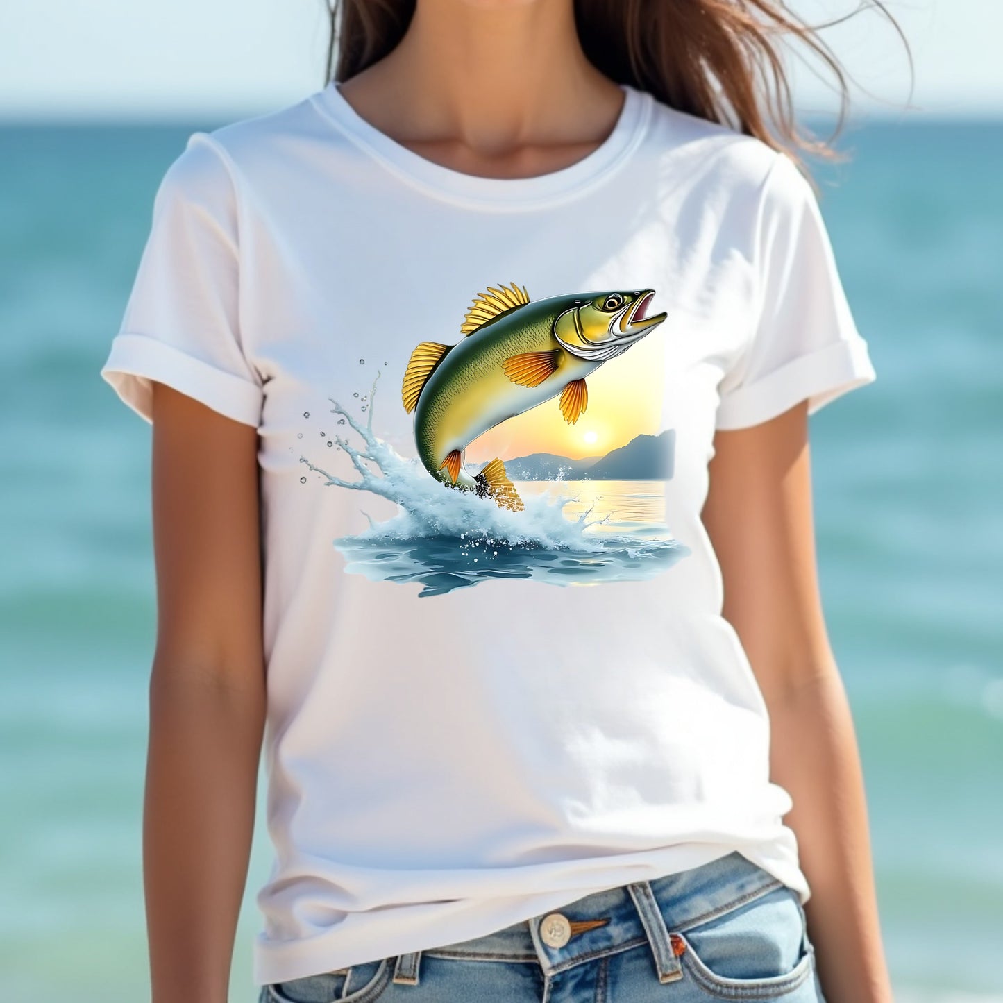 Woman wearing a white t-shirt with a walleye fish graphic against a blurred beach background