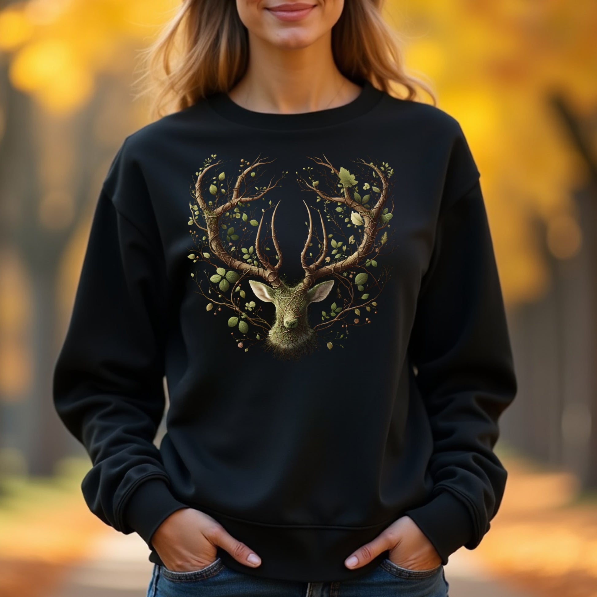 Woman wearing a black sweatshirt with a deer design in an autumn setting