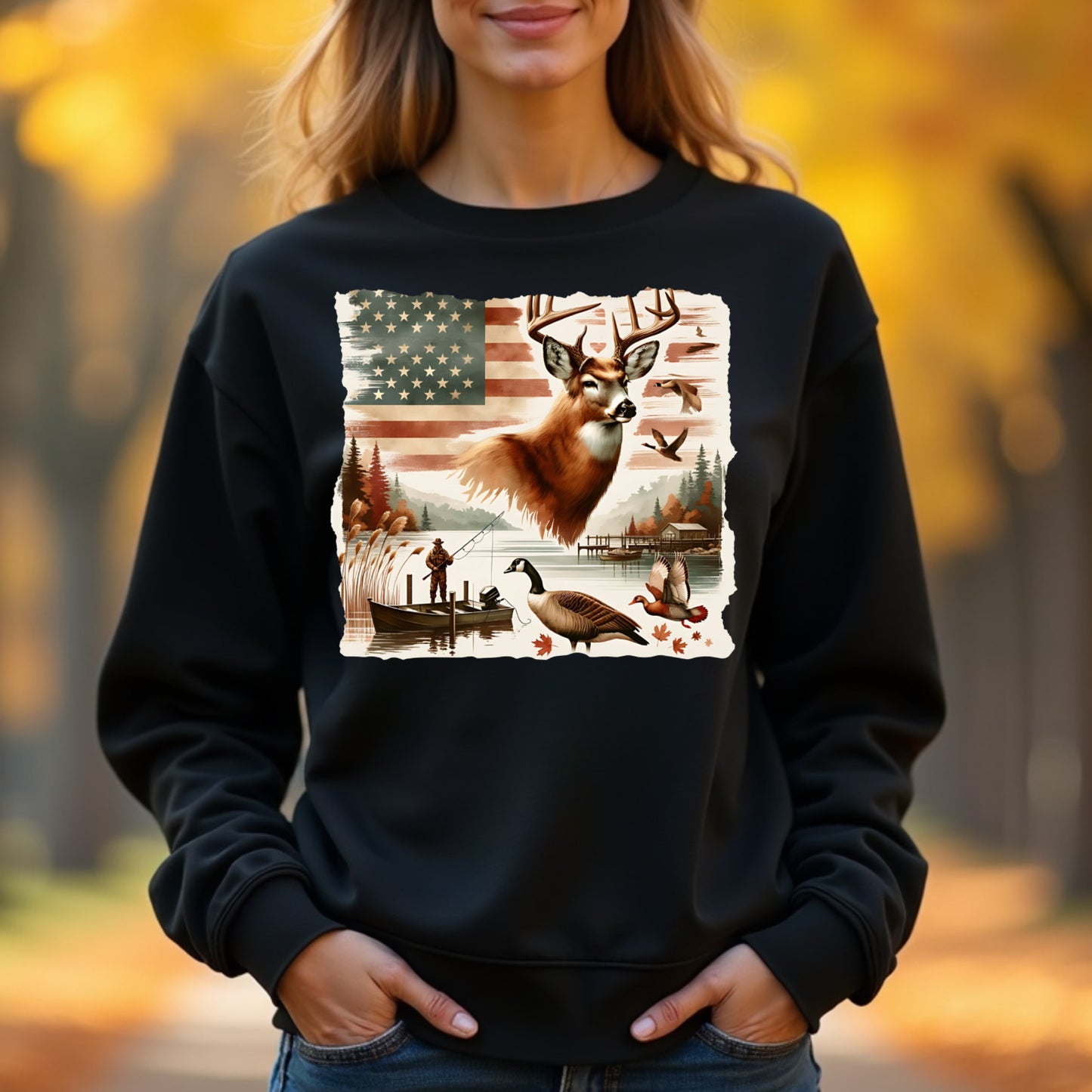Woman wearing a black sweatshirt with a nature-themed graphic in an outdoor setting