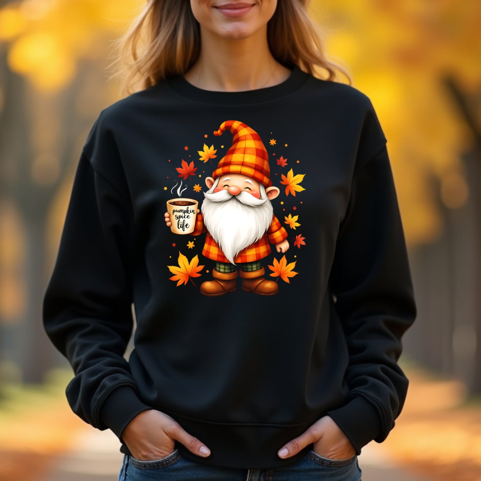 Woman wearing a black sweatshirt with a gnome graphic and autumn leaves in an outdoor setting.