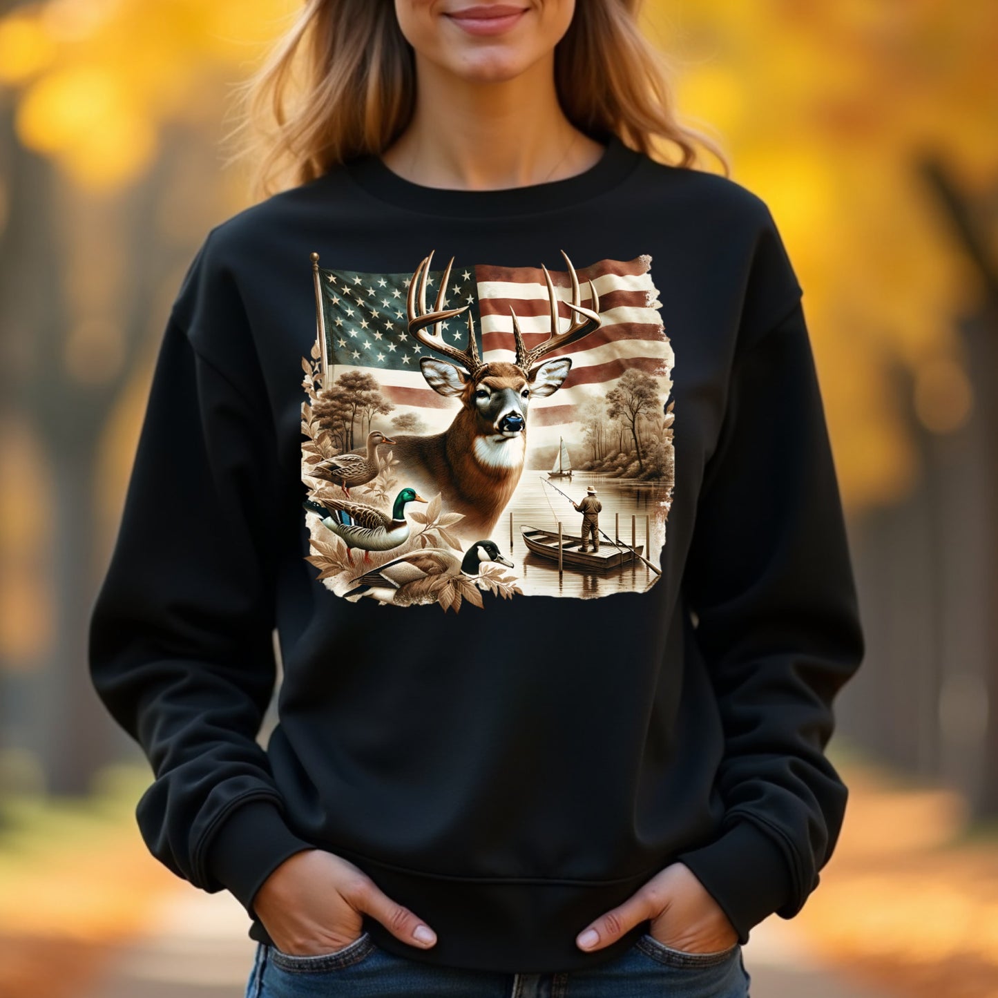 Woman wearing a black sweatshirt with a nature-themed graphic in an outdoor setting