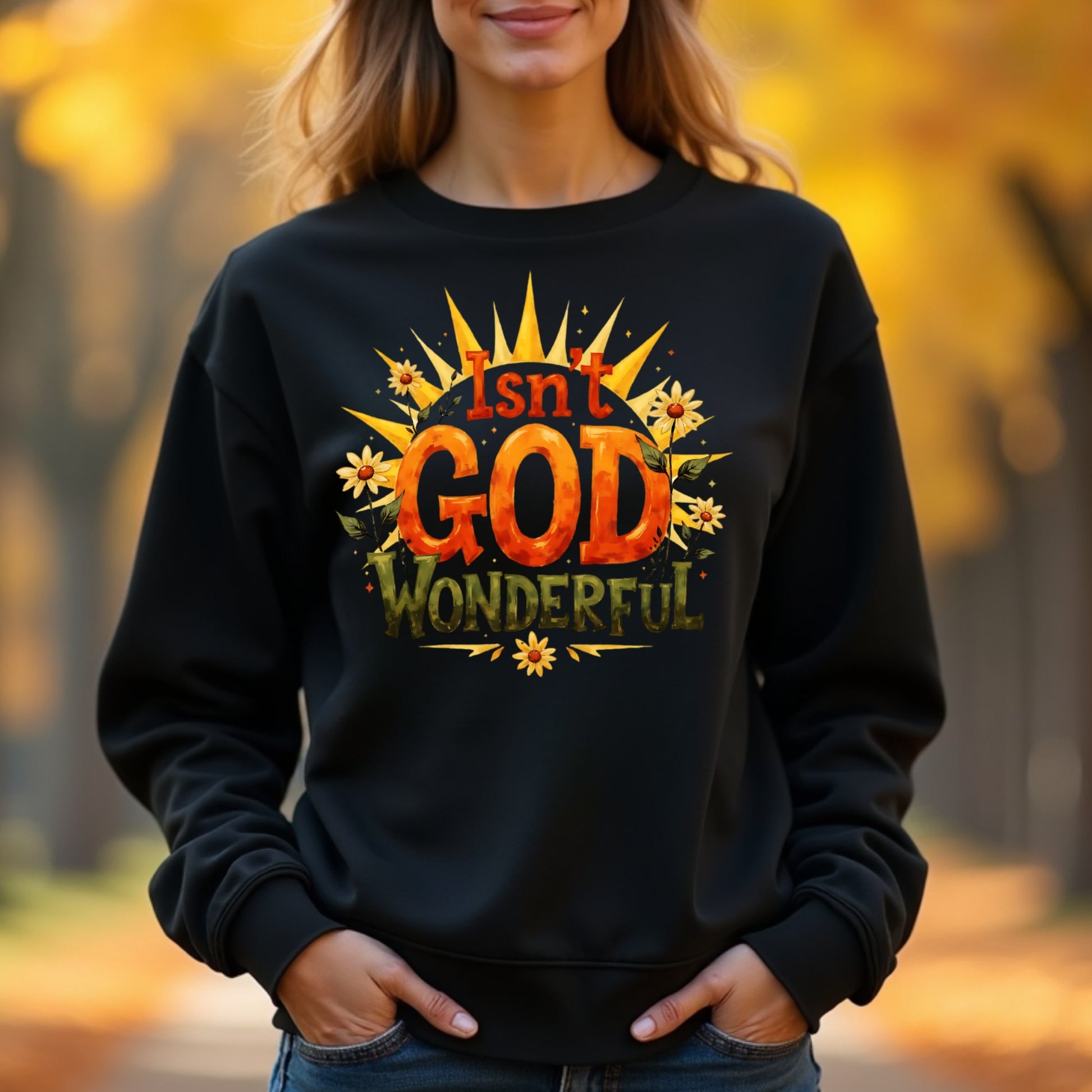 Woman wearing a black sweatshirt with 'Isn't God Wonderful' text in an autumn-themed design.