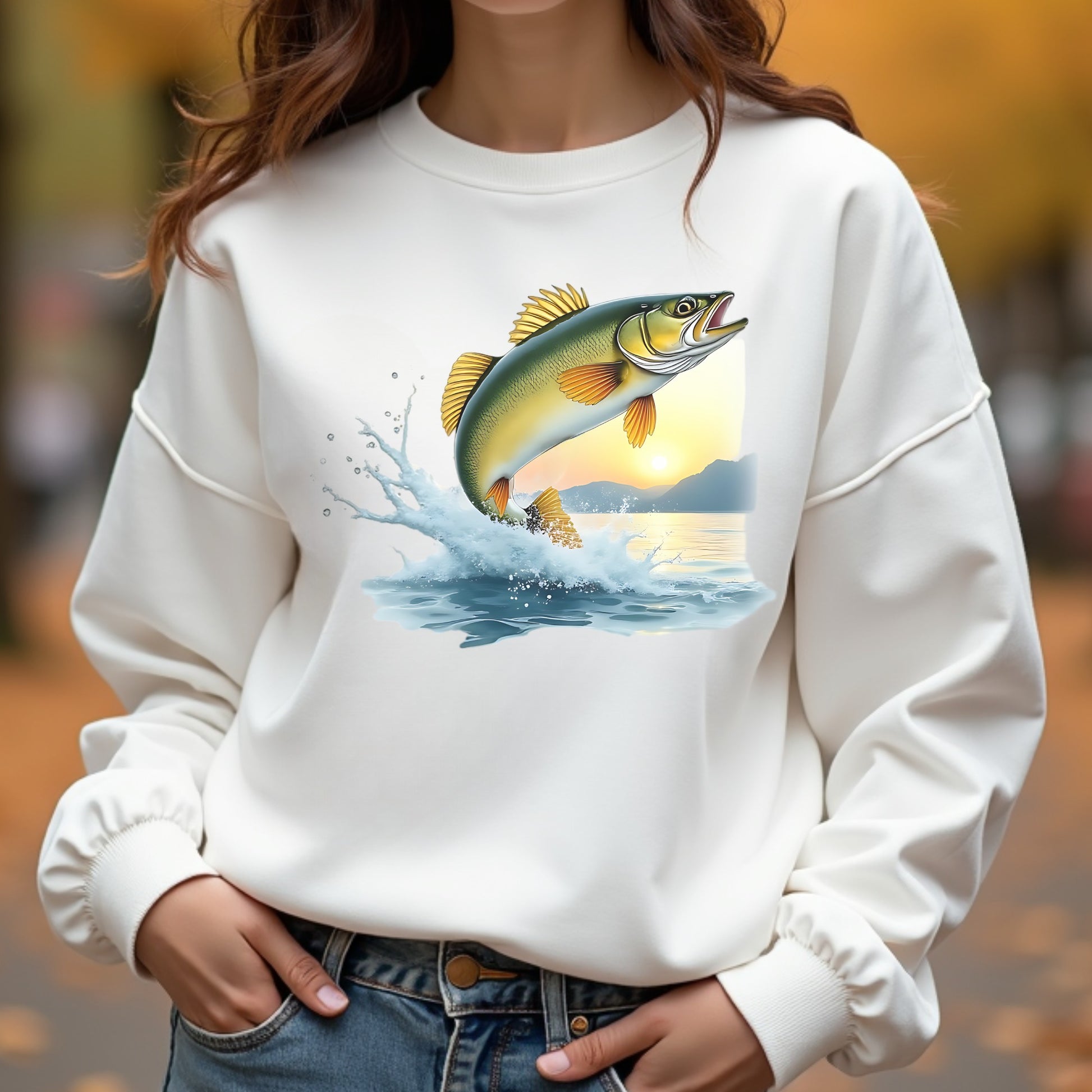 White sweatshirt with a fish graphic worn by a woman outdoors