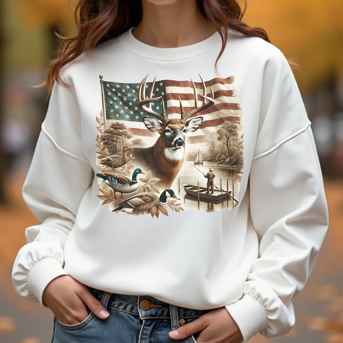 White sweatshirt with a nature-themed graphic featuring a deer, American flag, and ducks.