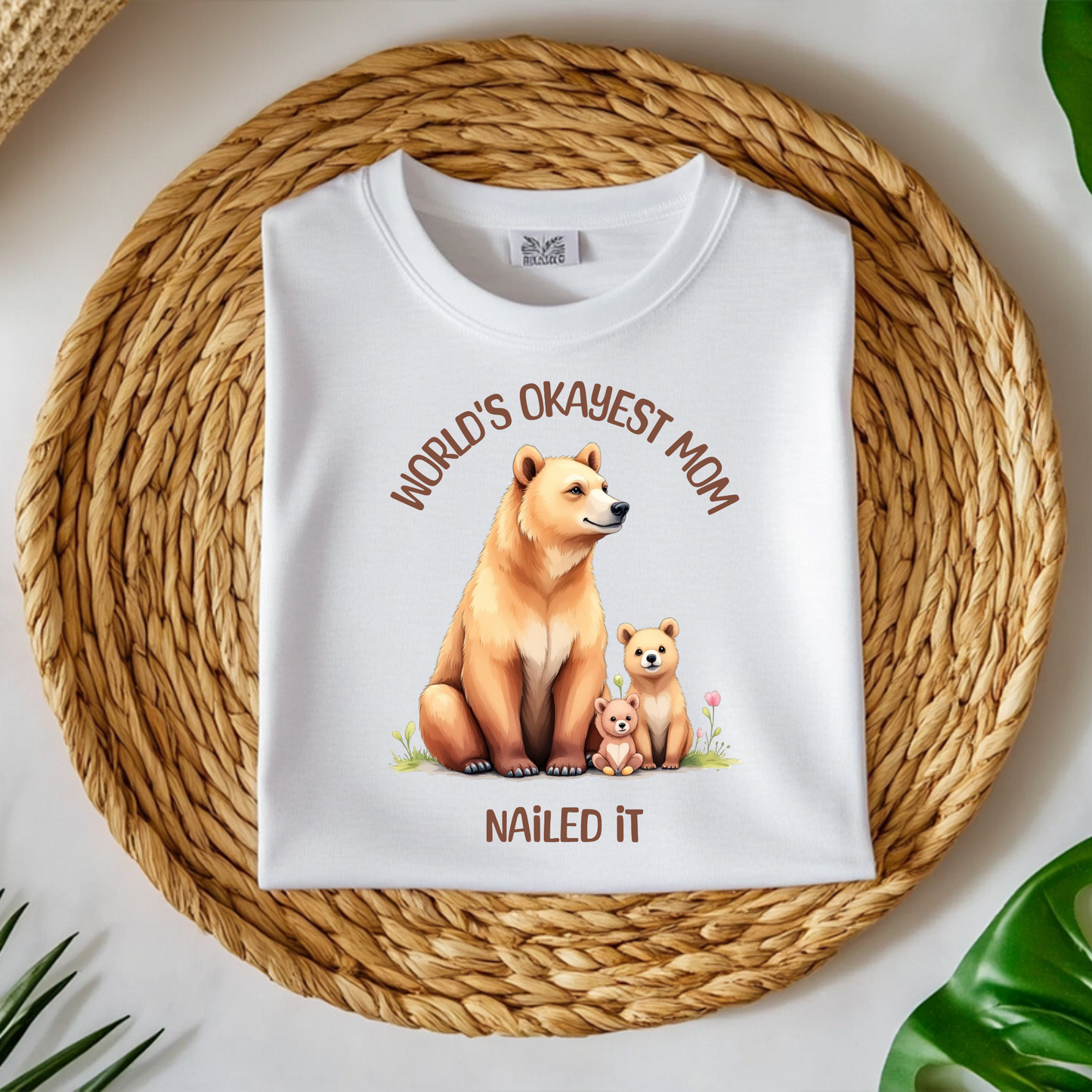 World’s Okayest Mom Nailed It digital design on a folded t-shirt