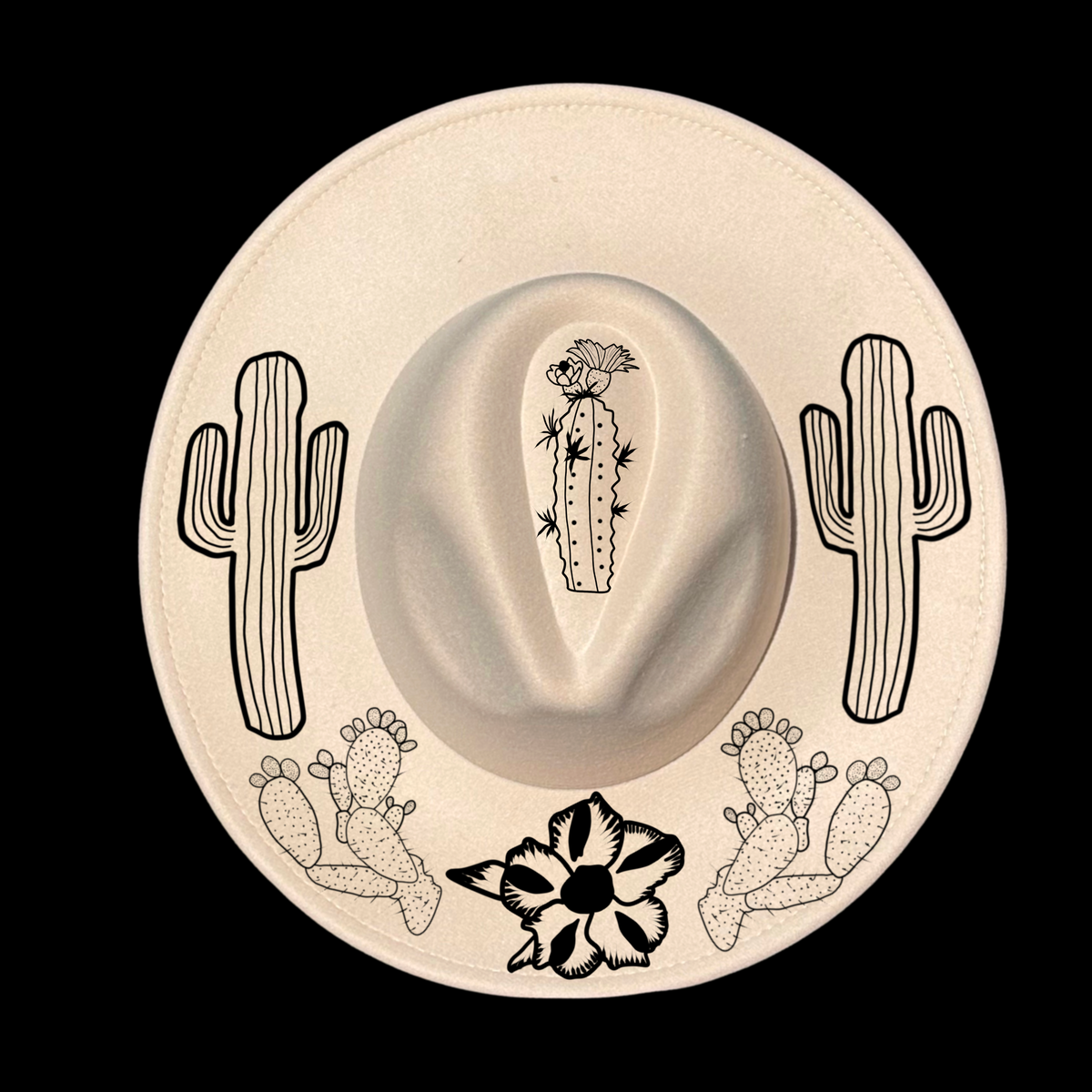 A beige wide brim hat with a floral and cactus design on the brim.