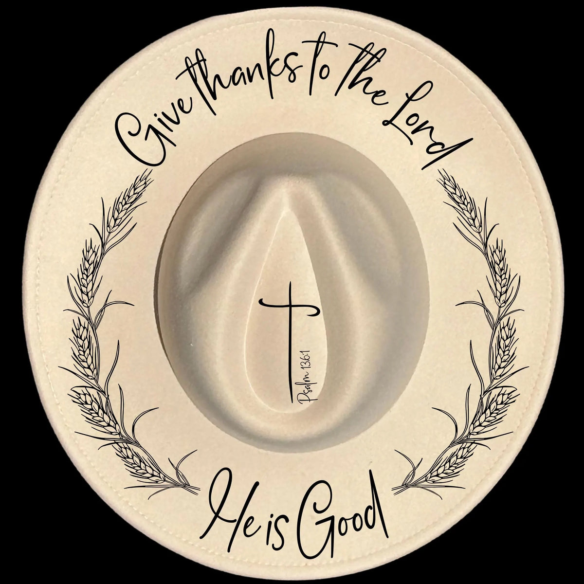 A white wide brim hat with black text and design elements, including a cross and wheat patterns.