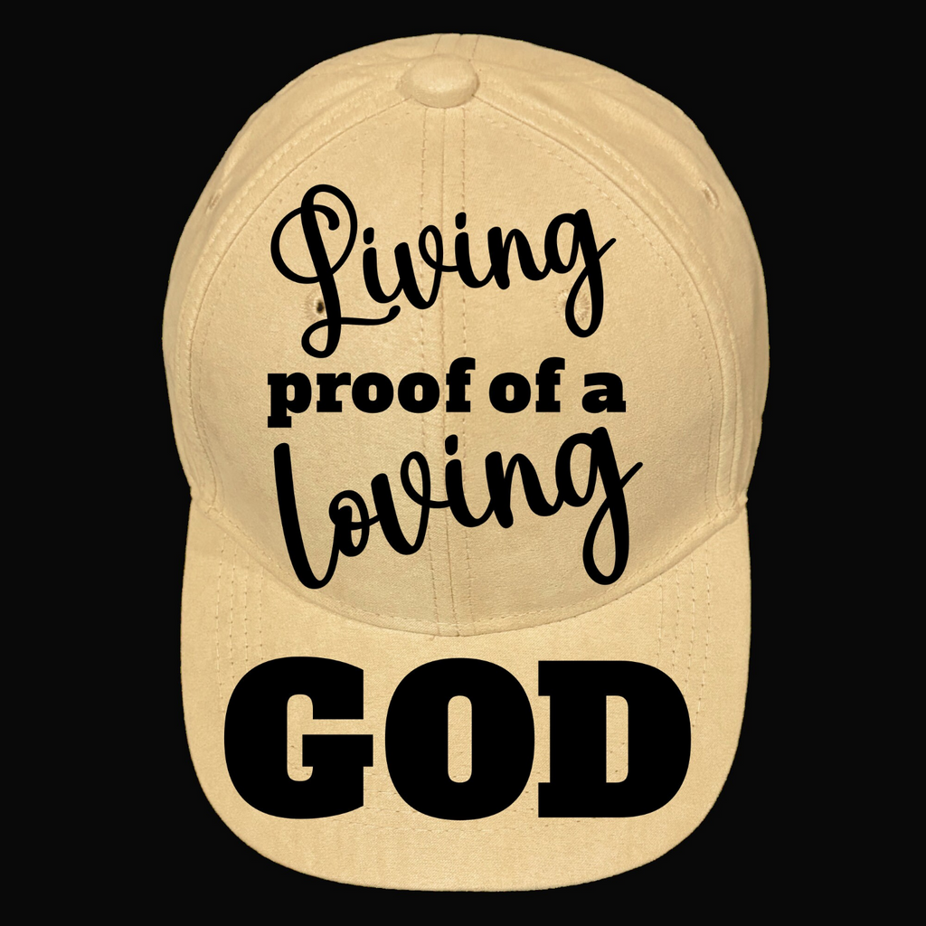 A beige baseball cap with the text 'Living Proof Of A Loving God' printed on the front.