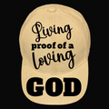 A beige baseball cap with the text 'Living Proof Of A Loving God' printed on the front.