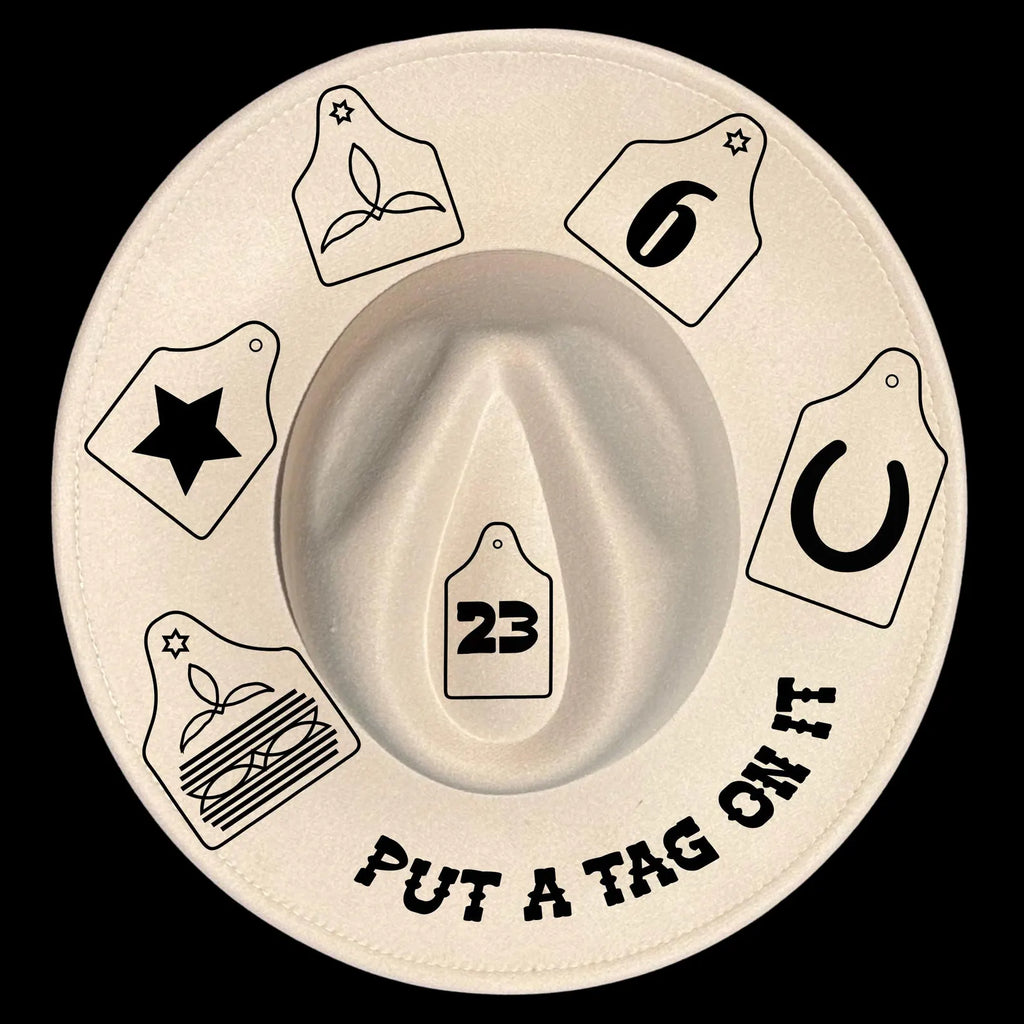 Hat burning design on a wide brim hat with various tags and the text 'Put a tag on it' on a black background
