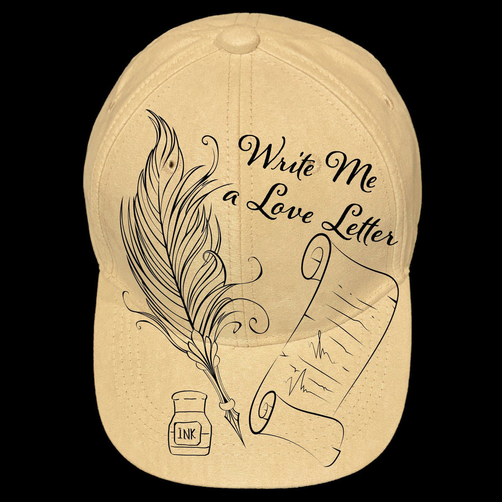 A beige baseball cap with a graphic design of a pen and ink bottle, and the text 'Write me a love letter'.