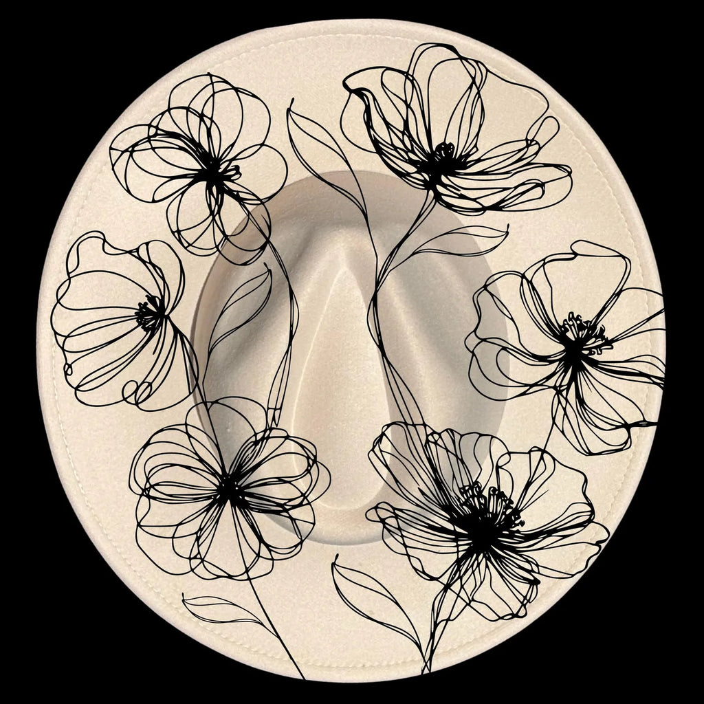 Decorative hat burning design with black poppies designs on a beige wide brim hat
