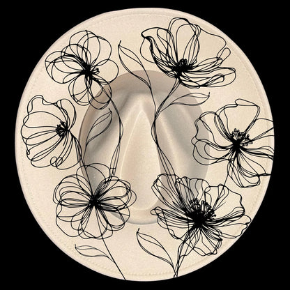 Decorative hat burning design with black poppies designs on a beige wide brim hat