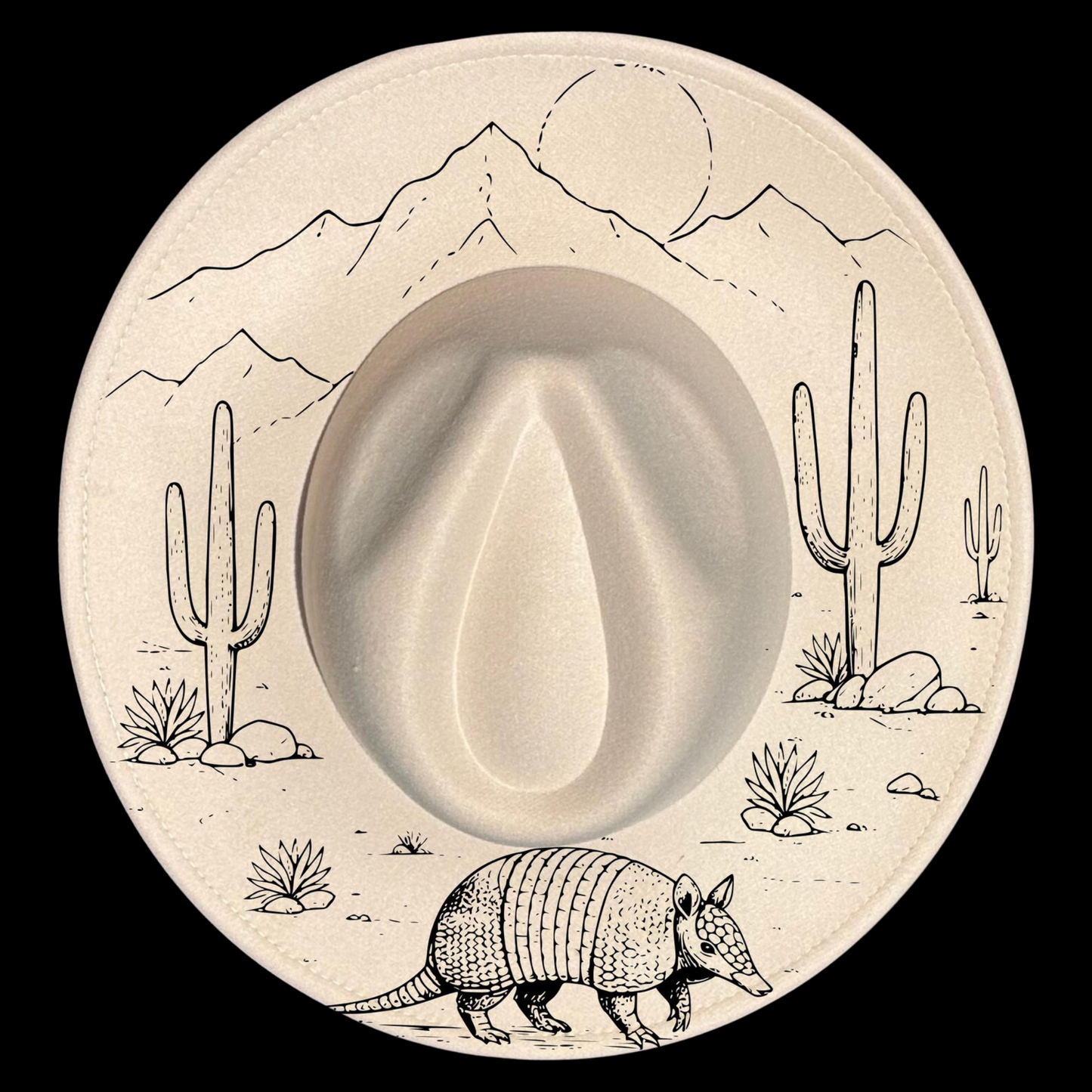 A wide brim hat with desert scene including cacti, mountains, and an armadillo.