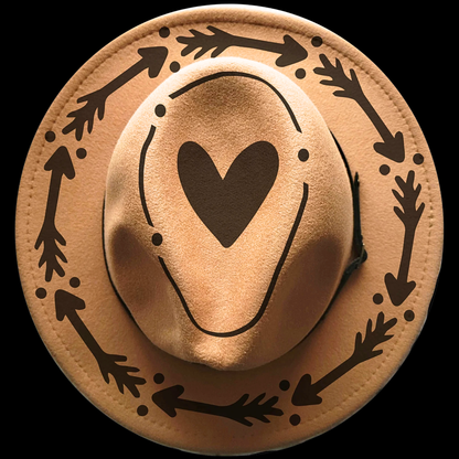 Cowboy hat with heart and arrow designs on a black background