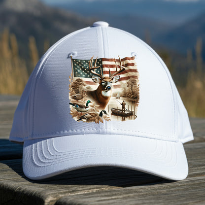 White cap with a deer and American flag design on a wooden surface with a mountain background
