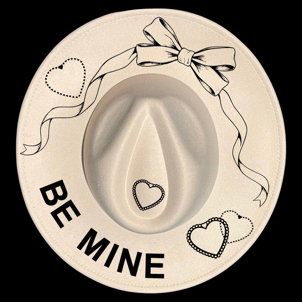 Heart-shapes with a bow, hearts, and 'BE MINE' text on a beige background
