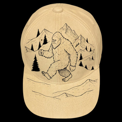 Baseball cap with a Bigfoot and mountain design on a black background