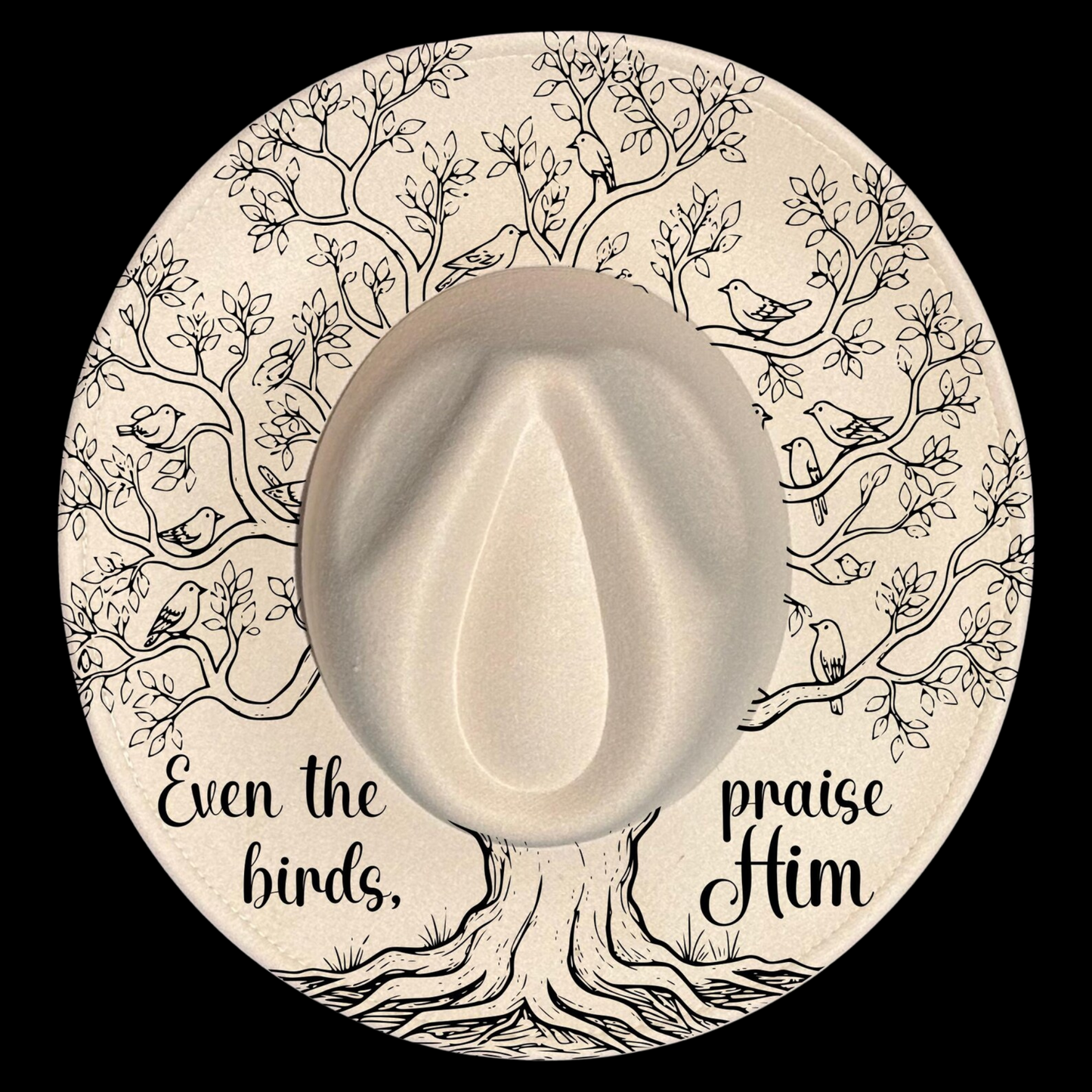 A wide brim hat with a tree of life illustration, featuring text 'Even the birds praise Him' on a black background.