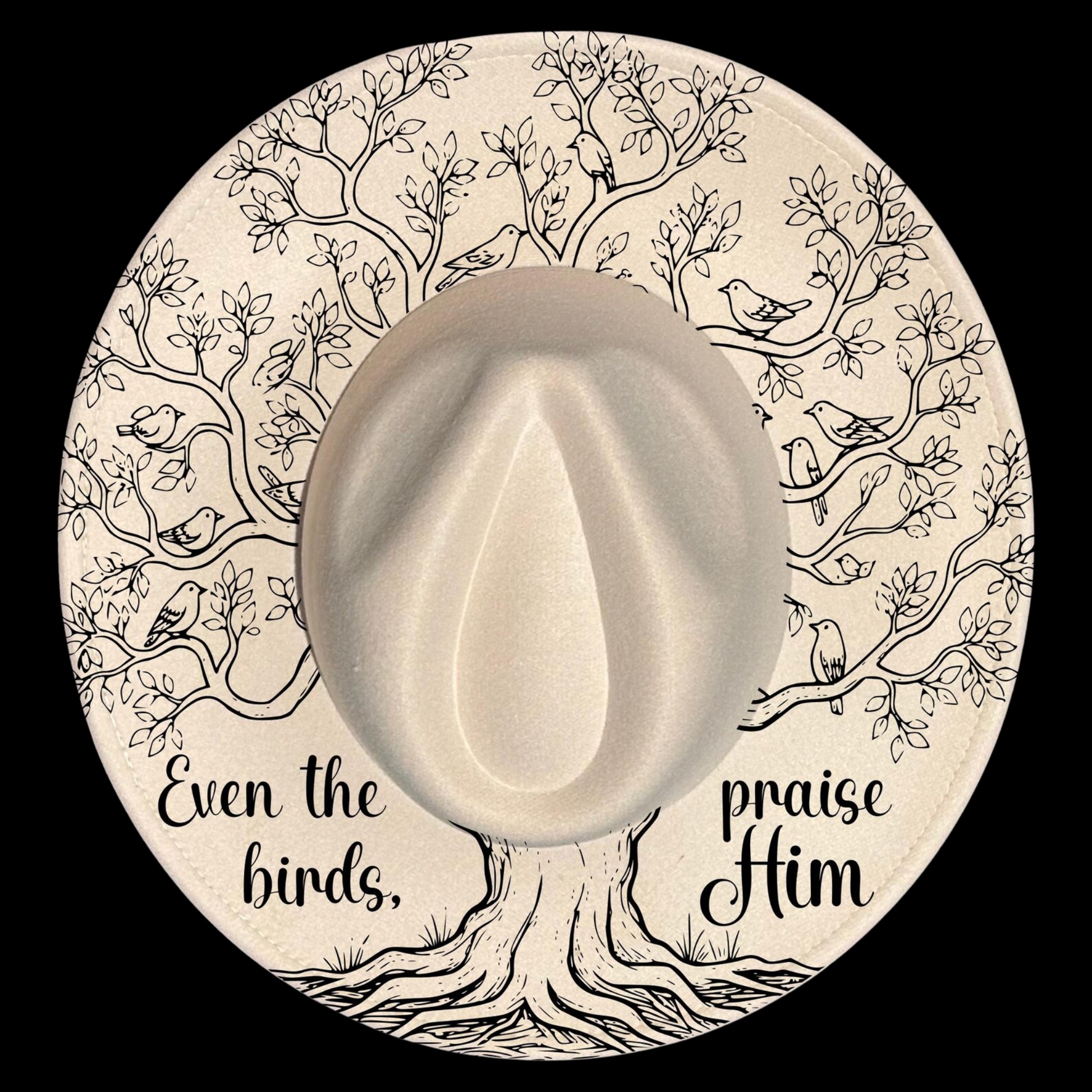 A wide brim hat with a tree of life illustration, featuring text 'Even the birds praise Him' on a black background.