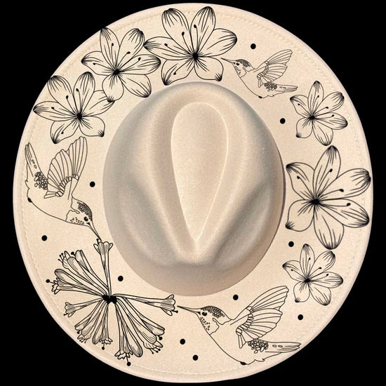Boho design on a wide brim hat with floral and hummingbird designs
