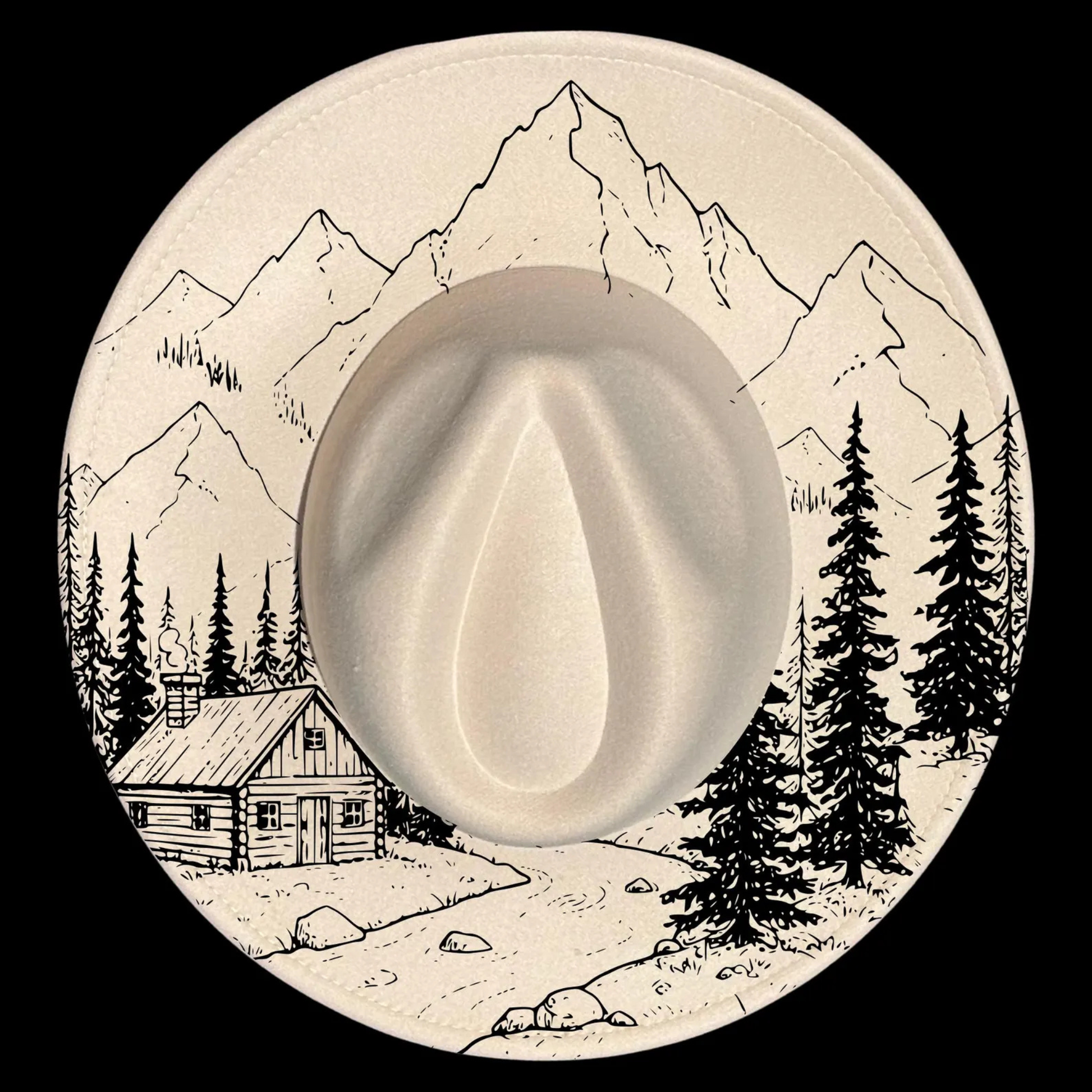 A wide brim hat with a mountain and cabin design on a black background