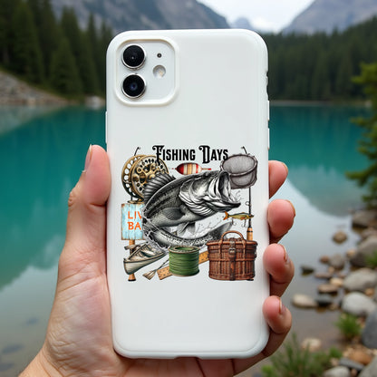 Phone case with fishing-themed design held in front of a scenic lake.