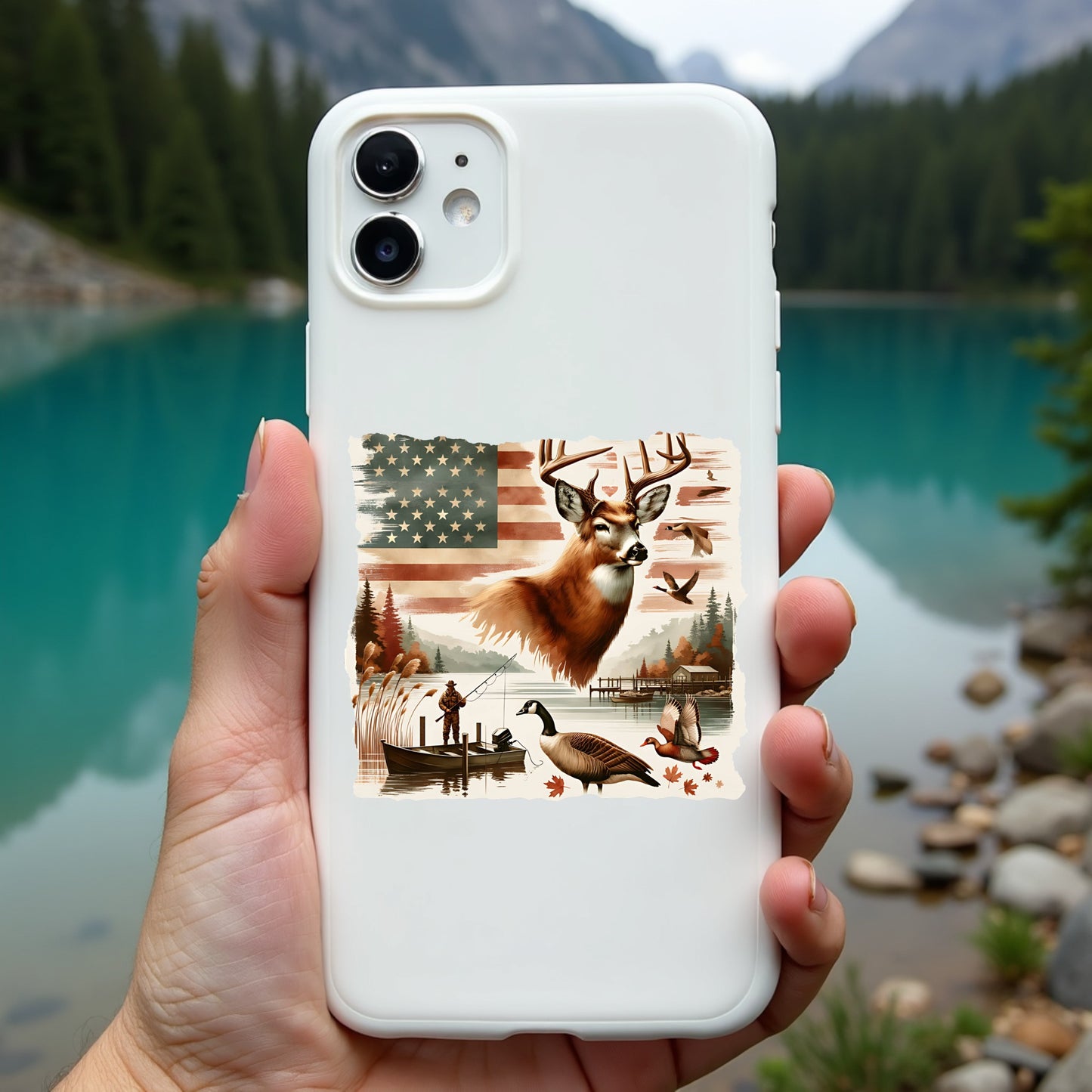 Phone case with nature design held in front of a scenic lake and mountains
