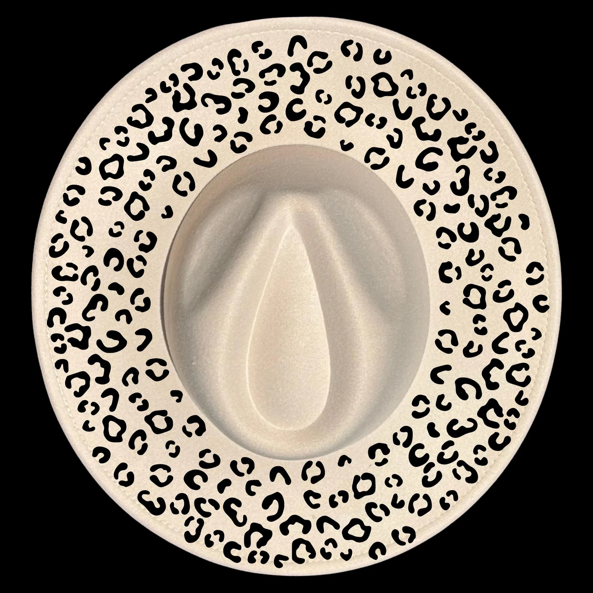 A wide brim hat with a leopard print design on a black background